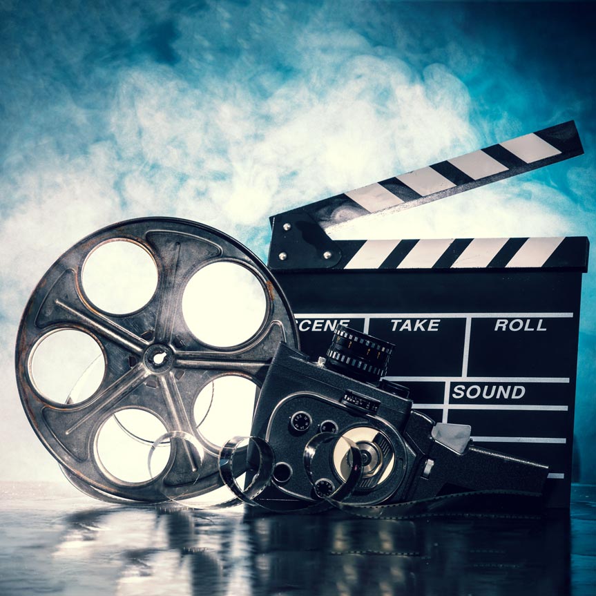 12360021-filmmaking-concept-scene-with-clapper-and-dramatic-lighting-Stock-Photo